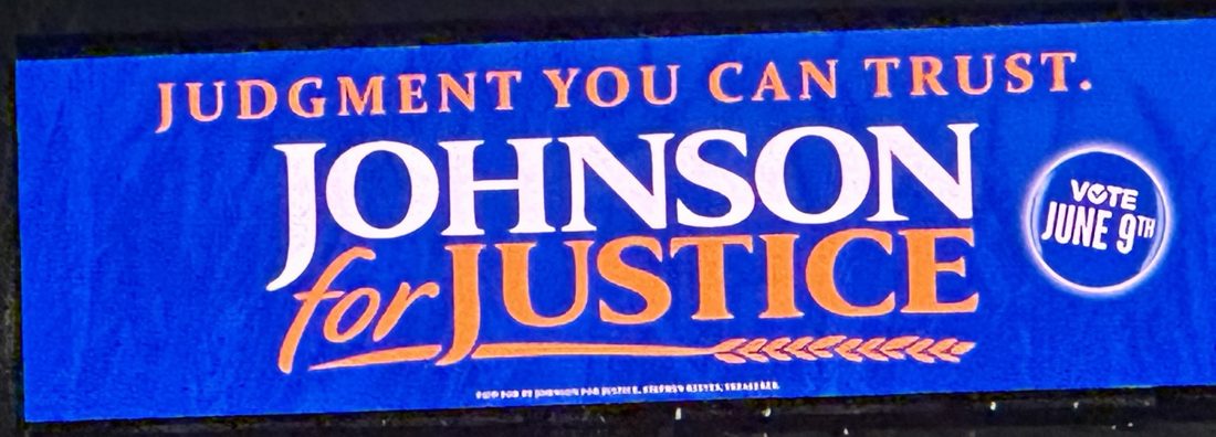 Johnson for Justice billboard reading Judgment You Can Trust.